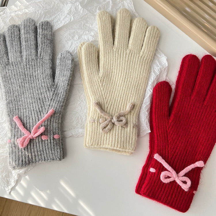 Geribde handschoenen met strikje bij de pols