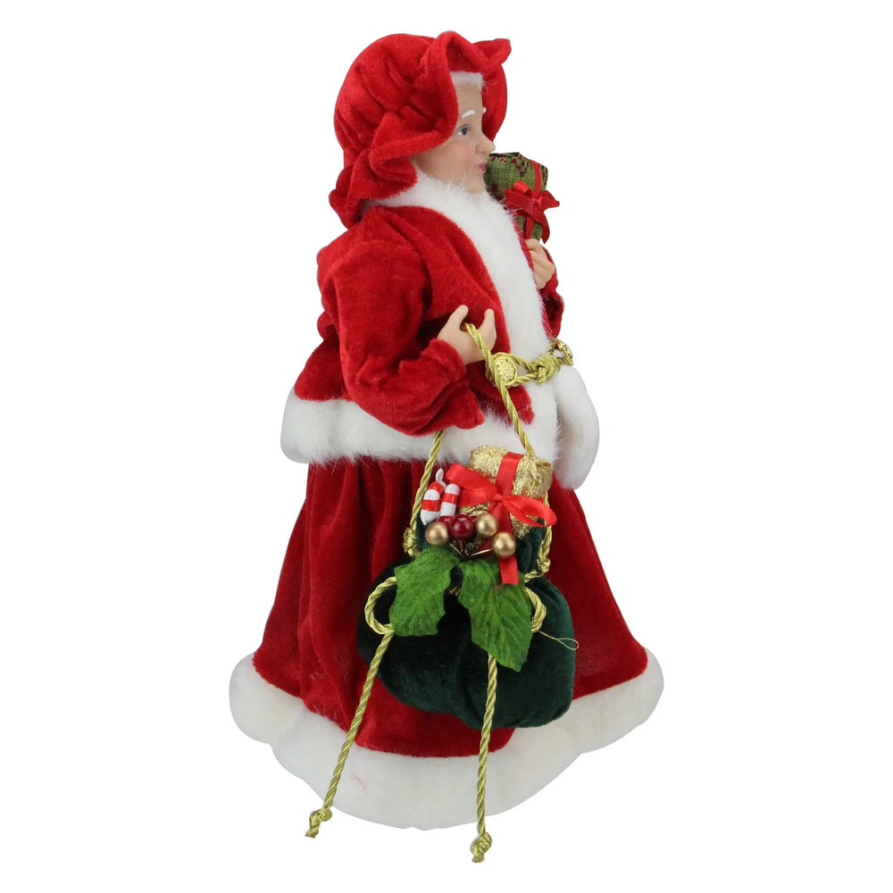 Kerstvrouw-beeldje in rode jurk met cadeau