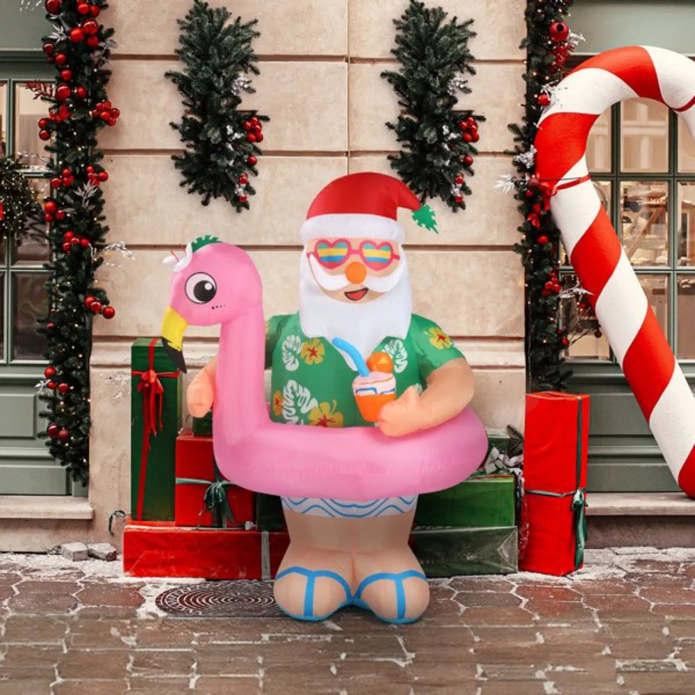 Opblaasbare kerstman op roze flamingo