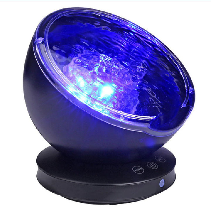 Projector met blauwe oceaangolven op plafond