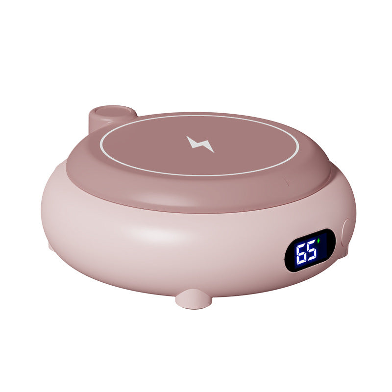 Roze mokwarmer met telefoon op laadvlak