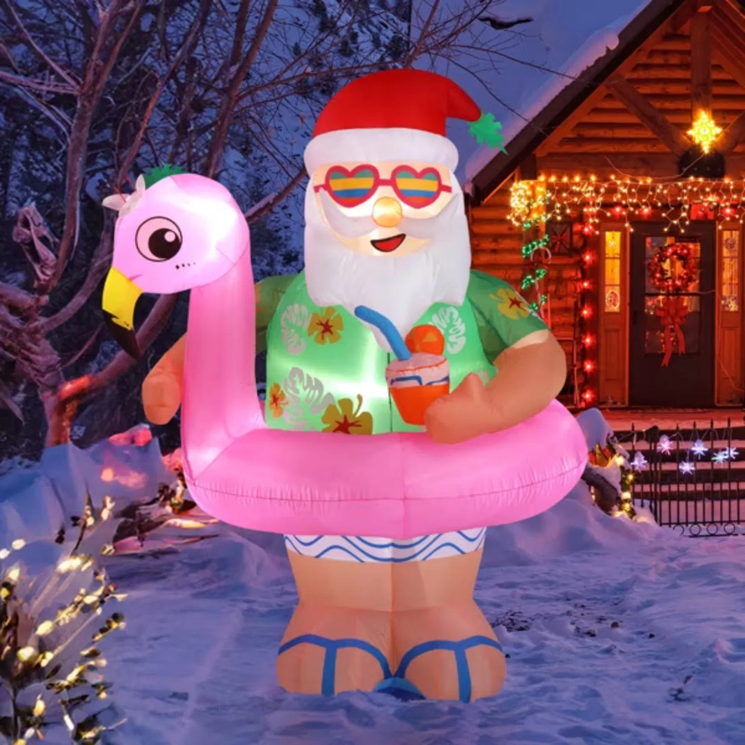Opblaasbare kerstman op roze flamingo
