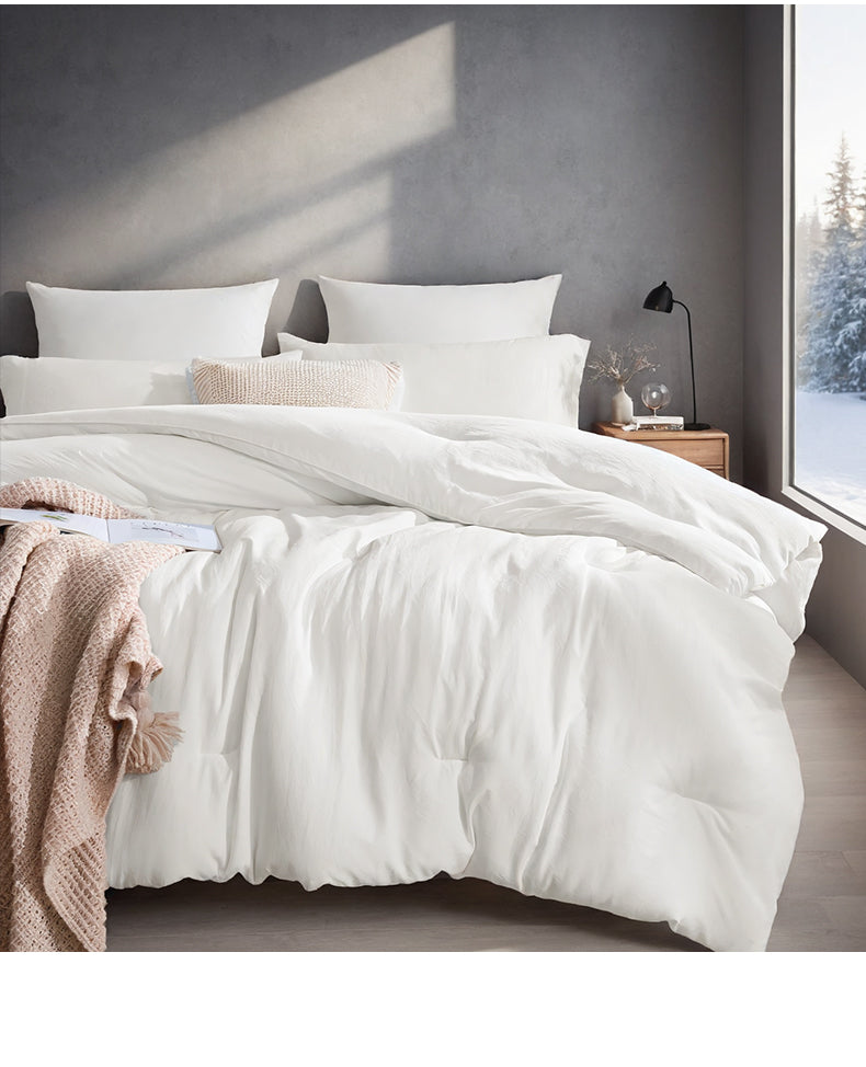 Wit dekbed met vakverdeling op bed