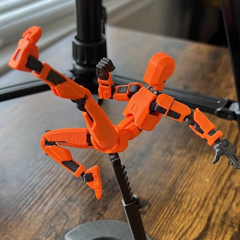 Oranje 3D-geprinte robotfiguur in actiehouding