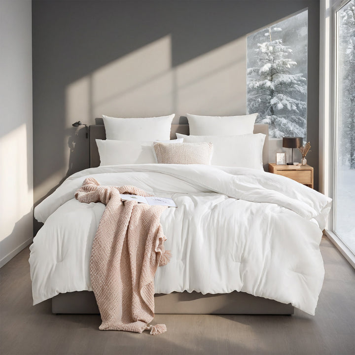 Wit dekbed met vakverdeling op bed