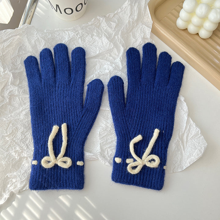 Geribde handschoenen met strikje bij de pols