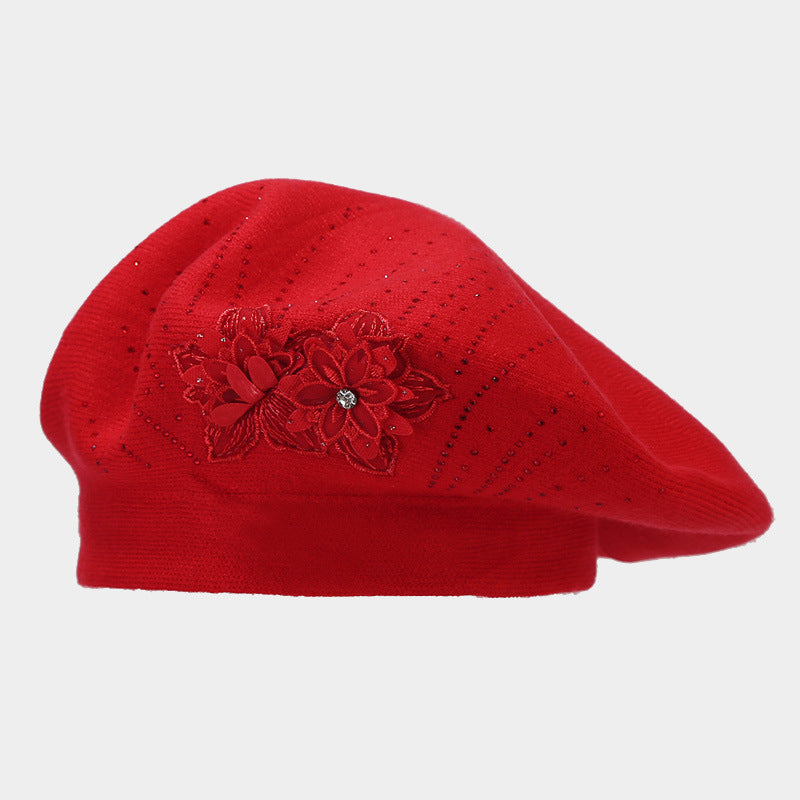 Gebreide baret met bloem en strass