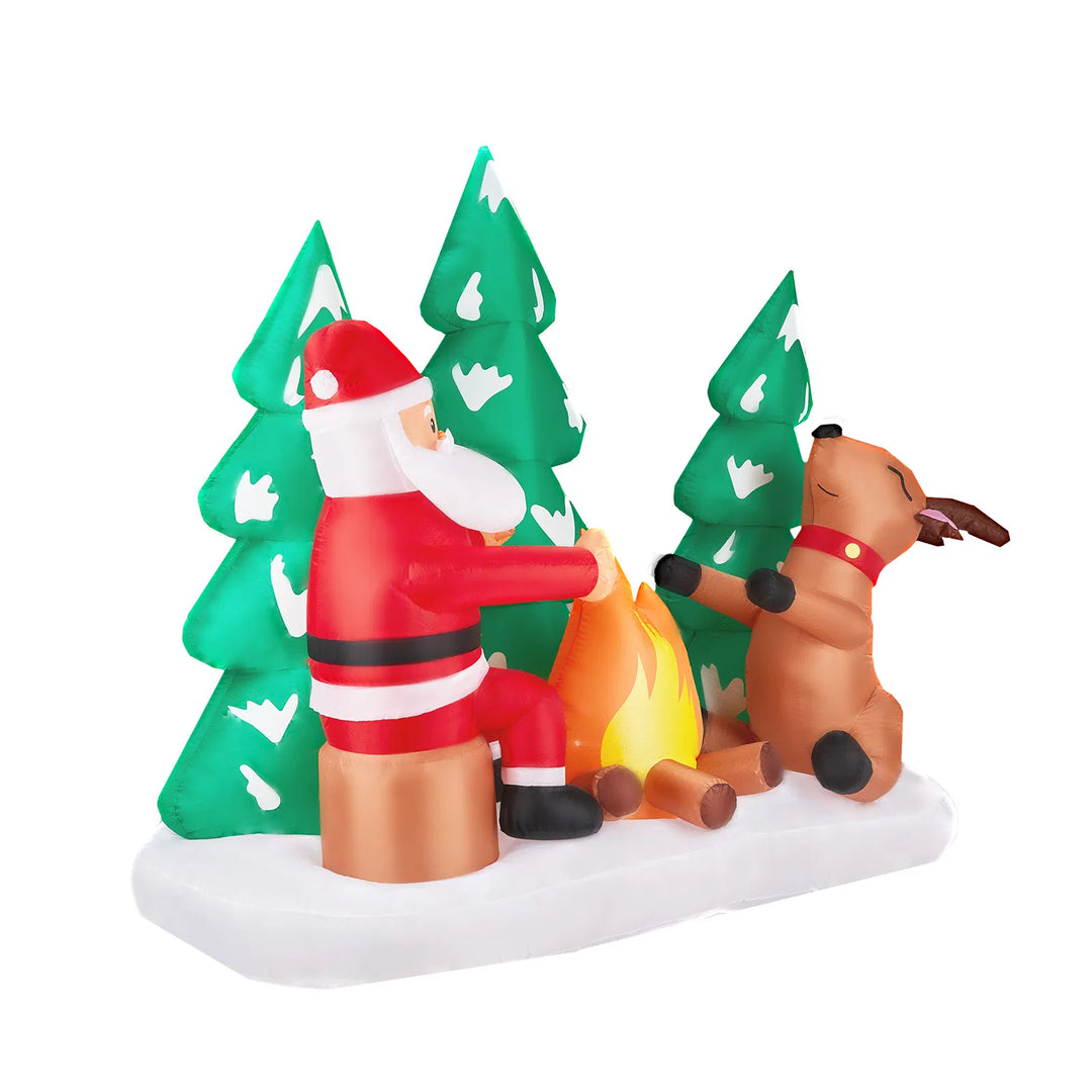 Opblaasbare kerstman bij kampvuur met rendieren