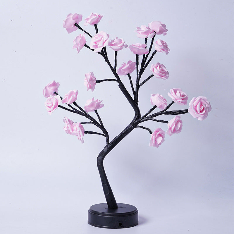 Rozenboom lamp met oplichtende roze rozen