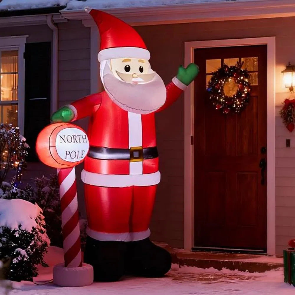 Grote opblaasbare kerstman met Noordpoolbord