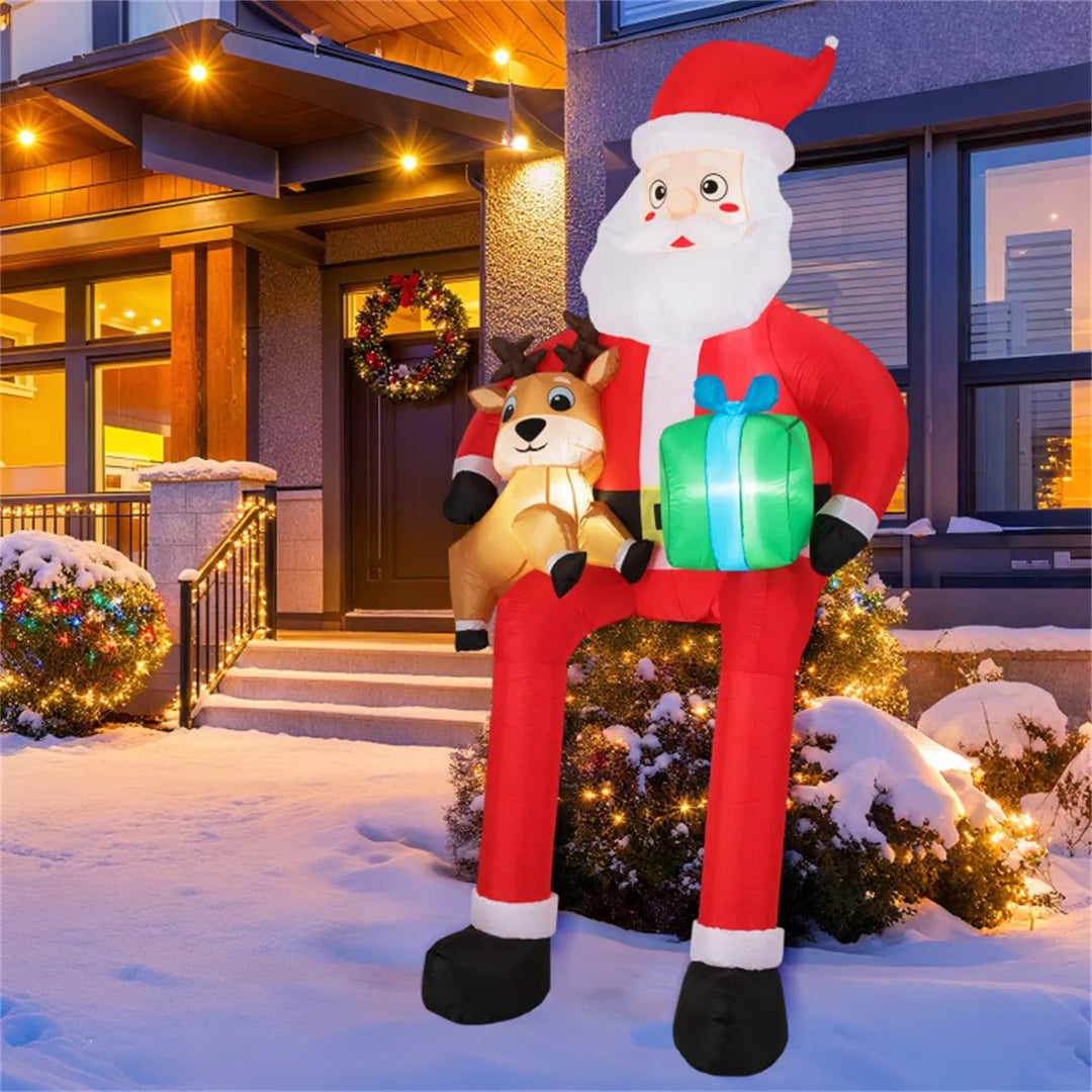 Grote opblaasbare zittende kerstman met rendier