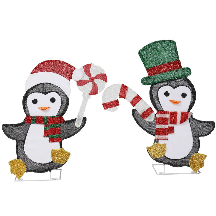 Twee verlichte pinguïns met zuurstok
