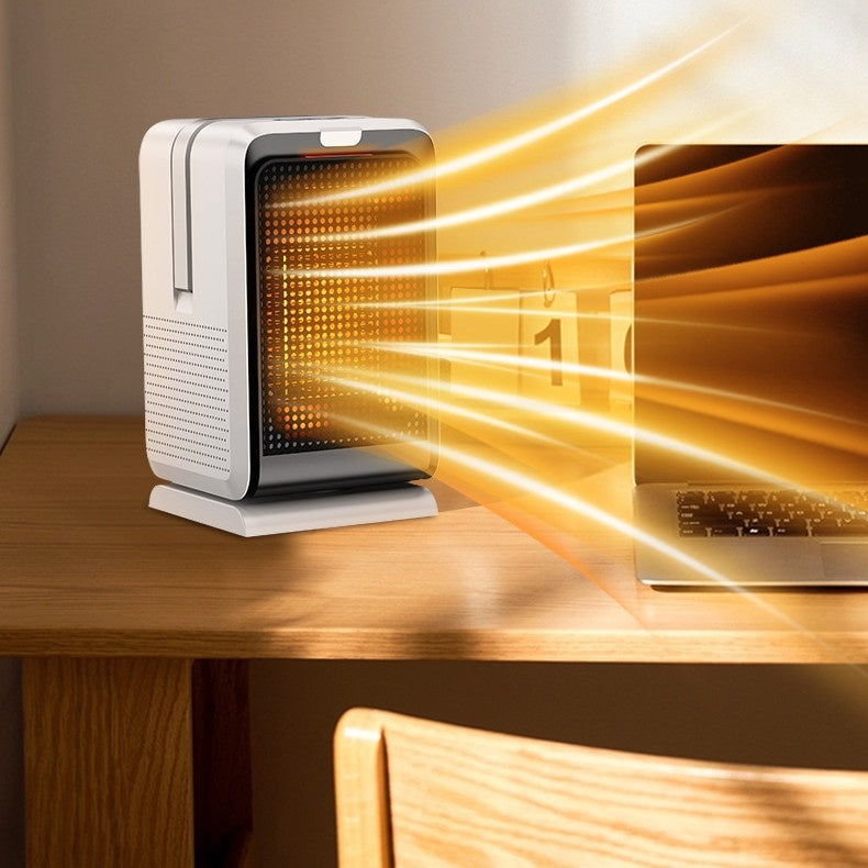 Keramische ventilatorkachel op een bureau