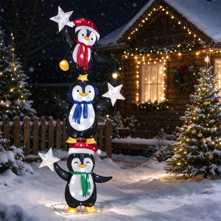Verlichte figuur met drie pinguïns