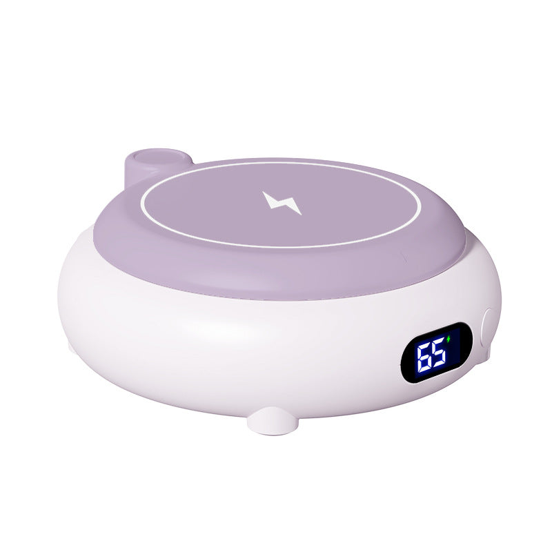 Roze mokwarmer met telefoon op laadvlak