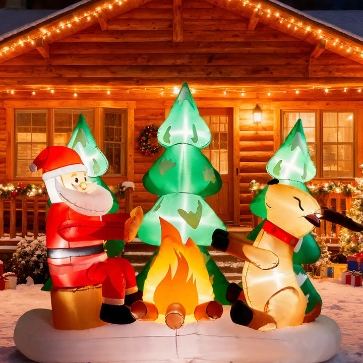 Opblaasbare kerstman bij kampvuur met rendieren